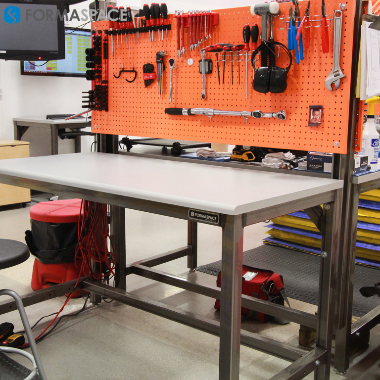 Manufacturing Workbenches with Orange Pegboards | Formaspace