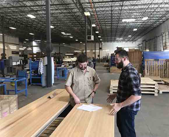 Production Manager, Cody Adams Speaking with Woodshop Supervisor, Phillip Mayes