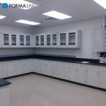 casework installment with pegboard and upper glass cabinets