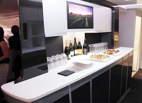 Many business travelers consider airplanes to be an extension of their office. A distinctive design element on Air New Zealand's new fleet of all-black Boeing 787-900s is the passenger cocktail bar. Its sleek black panels, separated by aluminum frames, are in keeping with the International Style.